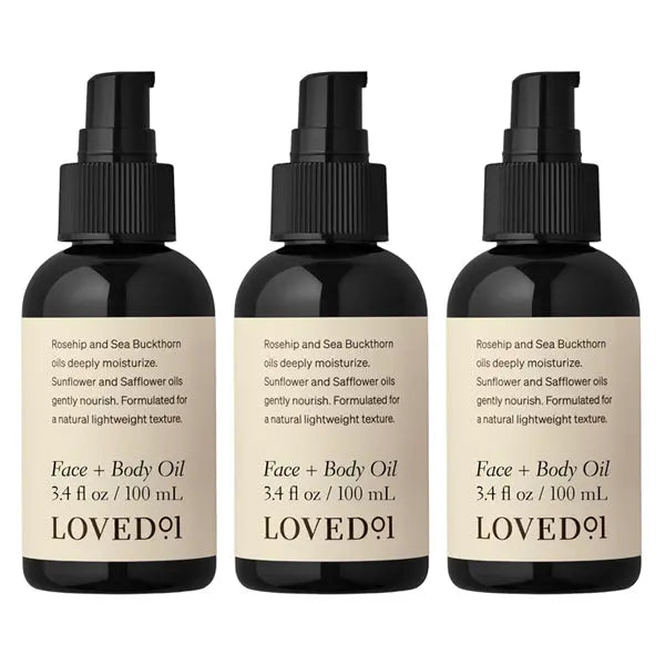The Loved 01 3 Pack Face + Body Oil with Rosehip & Sea Buckthorn (3.4oz each) hydrates and nourishes skin, featuring beige labels with ingredients and details.